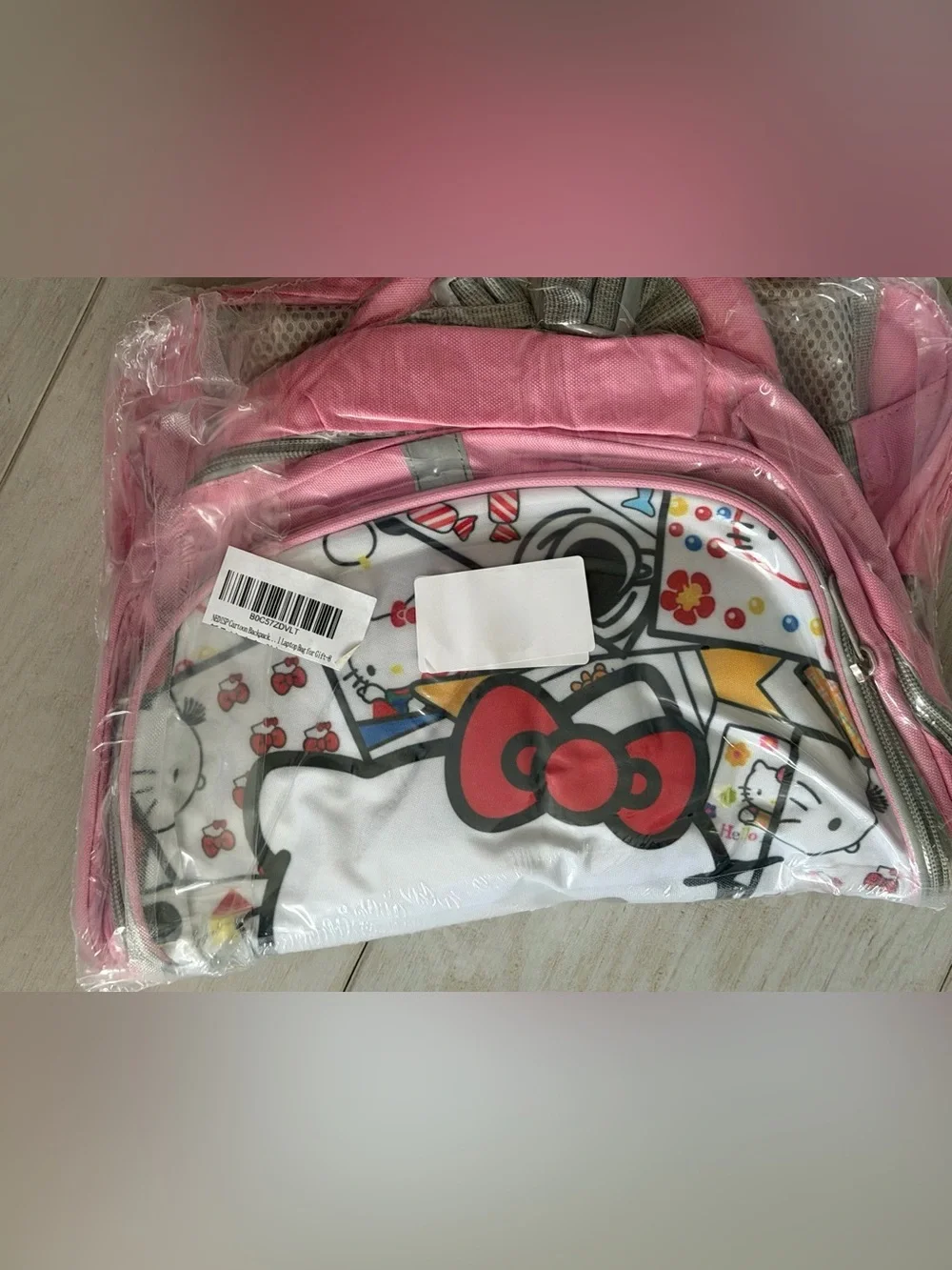 NEDISP Hello Kitty White Comic Collage Kids BOOKSACK with Pink/Gray Trim